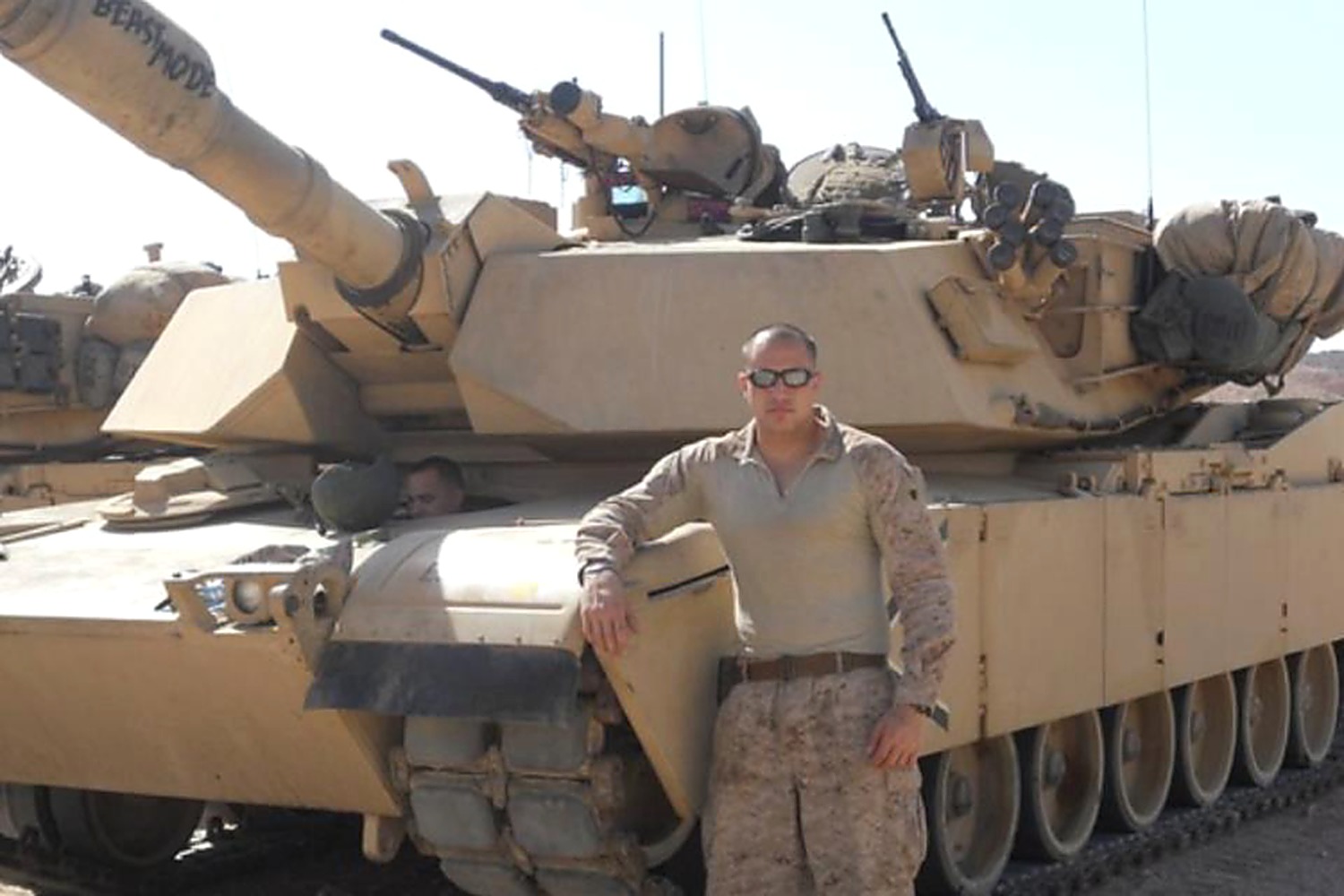 Mike Medina standing in front of his M1A1 Abrams tank during USMC service in Iraq and Afghanistan